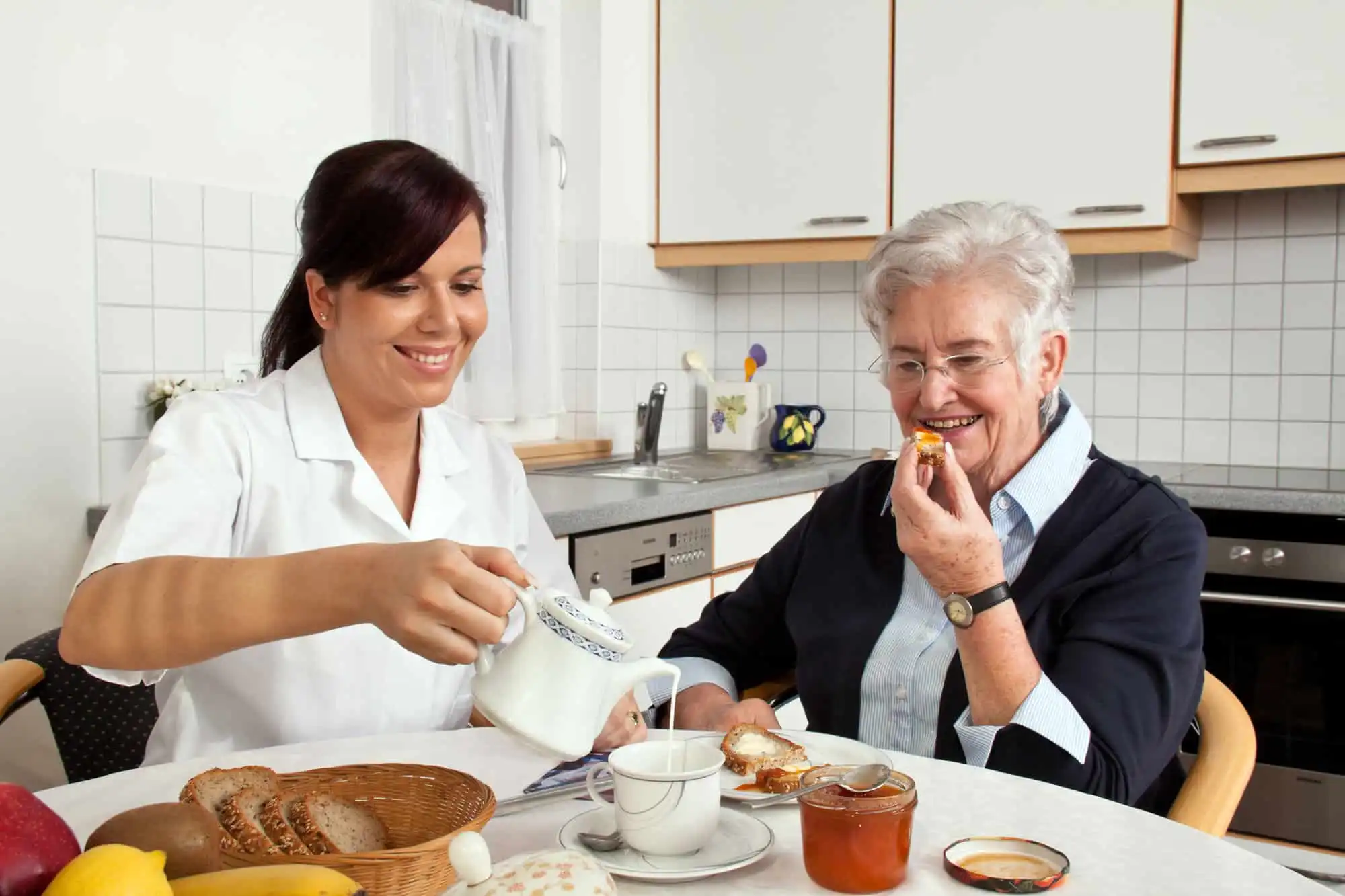 Senior being assisted by a caregiver